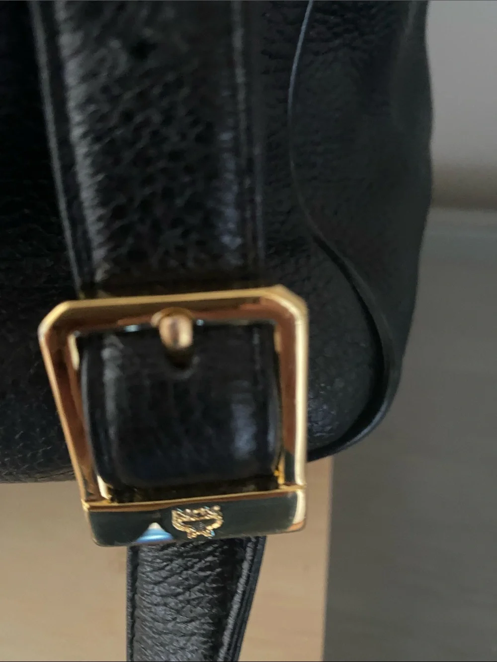 MCM Black Pebbled Leather Backpack with Gold Emblem Hardwarer